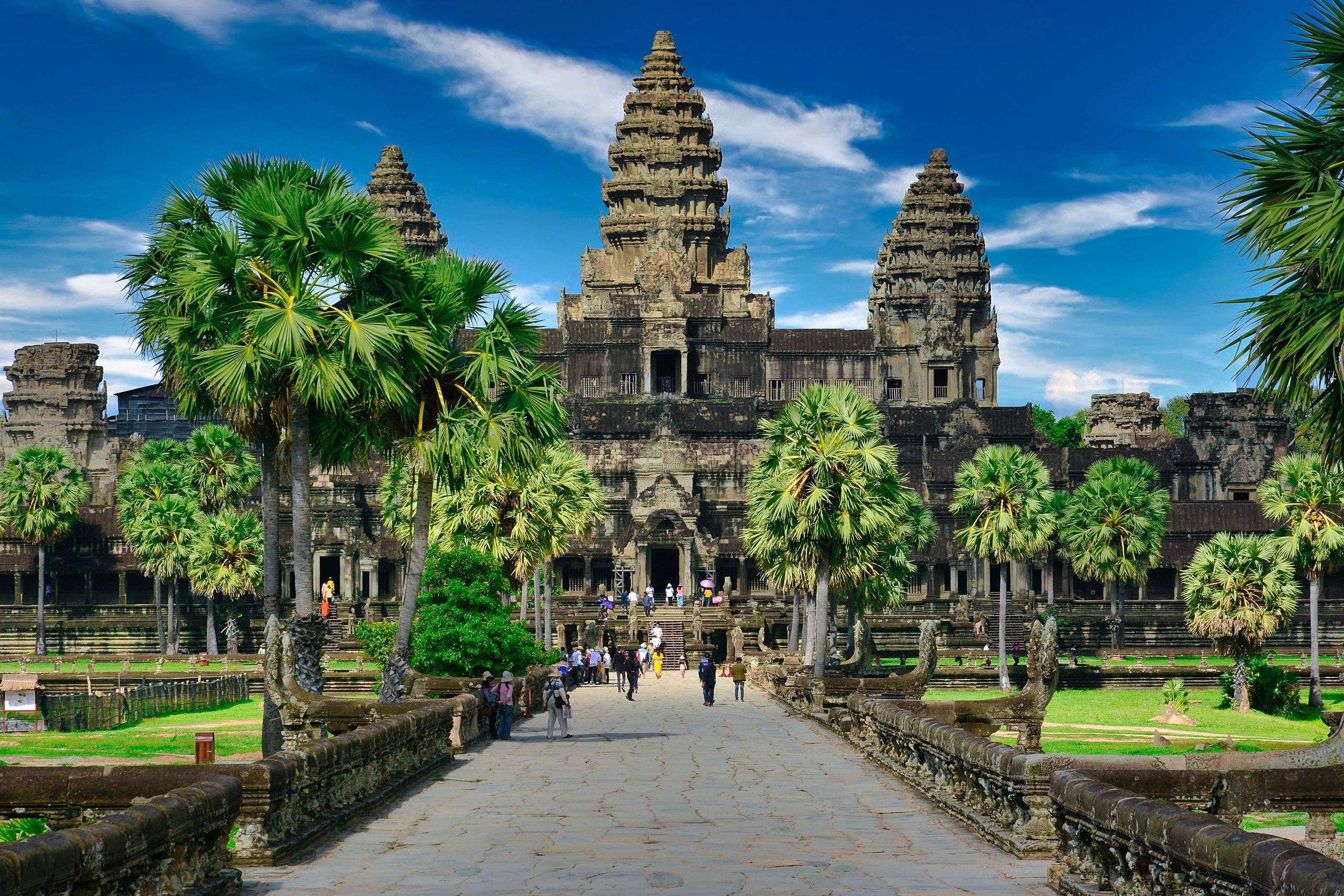Angkor Wat temple complex in Cambodia surrounded by palm trees